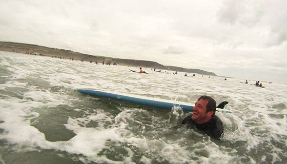 Simon trying to surf!